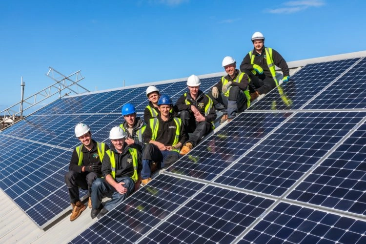 The TLGEC Commercial Solar Panel install team at Guernsey Power Station Installation in 2018