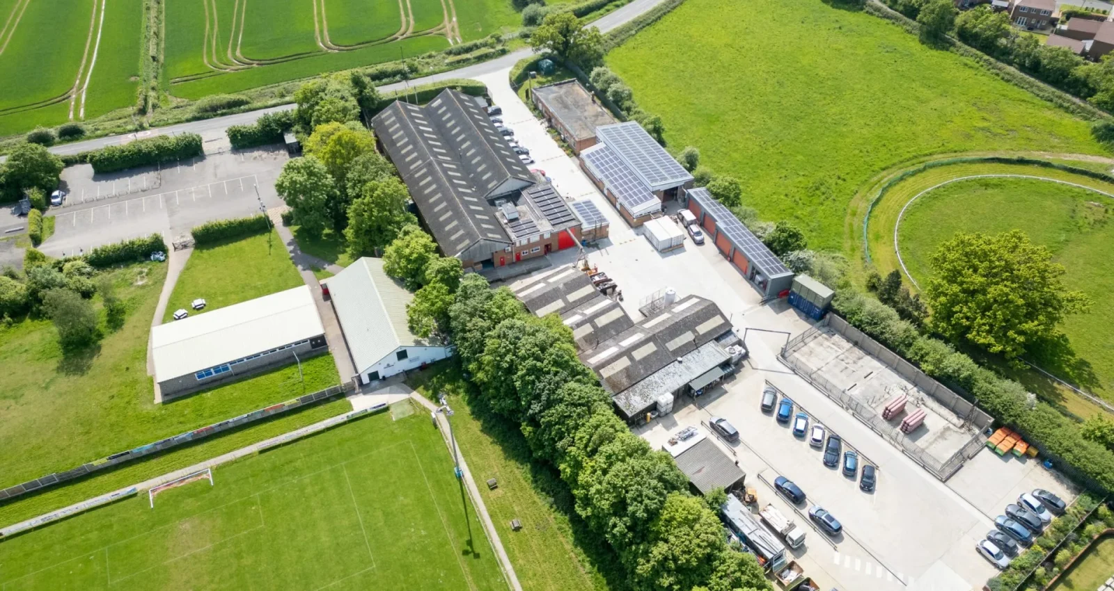 Overhead photo of factories with solar panels on roof