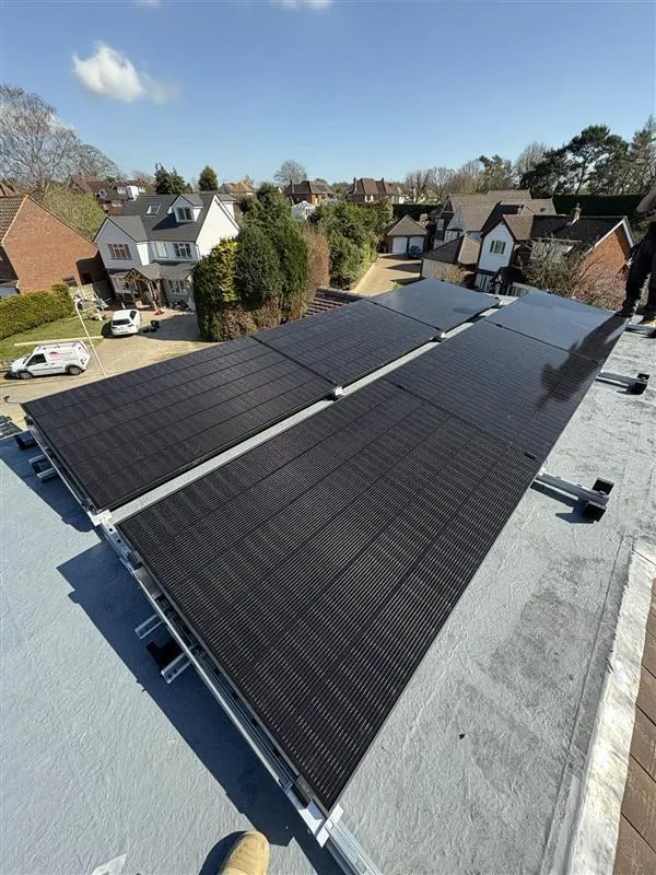 Six newly installed SunPower Performance 7 solar panels on a flat section of roof in the sunlight